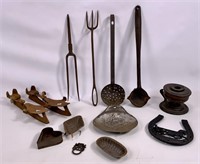 Iron ice skates, dippers, fork, lamp, tin pans.