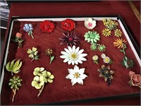 Showcase with vintage flower brooches