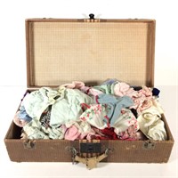 Old Suitcase Filled with Doll Cloths