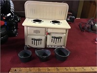 Vintage friction action toy stove with pots lot