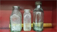 Three early glass bottles.