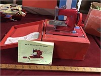 Red metal battery sew machine with carry box