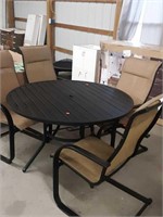 Round metal patio table with 4 chairs