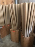 Four wooden boxes full of empty fabric tubes