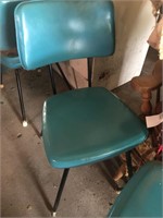 Four vinyl covered kitchen chairs