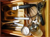 Contents of drawer: wooden handle noodle cutter -