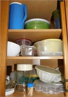 Plastic storage containers in corner cabinet