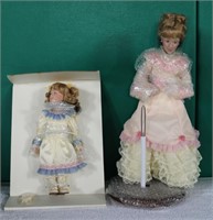Pair of Mother's Loving Touch Dolls and Stand