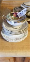 1 Teacup & many pretty saucers