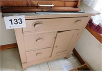 Painted oak 3-drawer, 1-door washstand on casters,