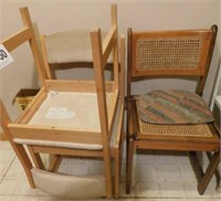 Two wooden dining chairs with upholstered seat
