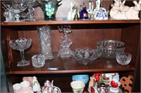 shelf of pressed glass dancing figuire, vases.