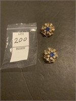 white and blue brooch