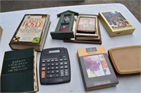 Picture frames, cards, books, calculator, etc