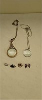 Magnifying glasses, pins, pendants