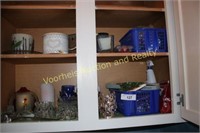Contents of cabinet in laundry room: candles,