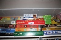 Closet shelf of games & puzzles, lite brite