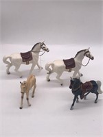Four horse glass figurines