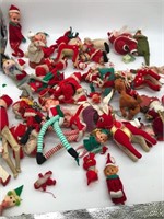 Lots of holiday decorations- shelf elves