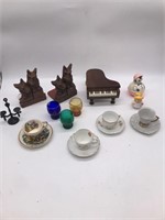 Antique cup and saucers, bookends, music box,