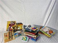 Assortment of books, coloring books, puzzles, Mr.