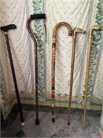 Grouping of five canes and two umbrellas
