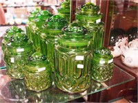 Six green Moon & Star canister jars with lids,