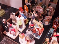 Nine figurines, mostly Norman Rockwell: