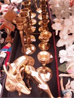 Nine brass items: seven candlesticks