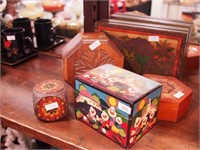 Five carved wooden boxes: one is highly decorated