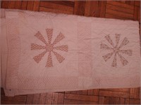 Vintage hand-stitched quilt in a spoke