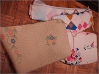 Three contemporary hand-stitched quilts, two with