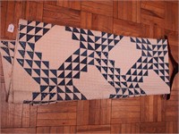 Vintage hand-stitched quilt in a modified