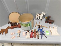 Various collectible dolls, wooden toys and squeezy