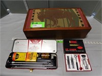 Decorative wood box with a gun cleaning kit and a
