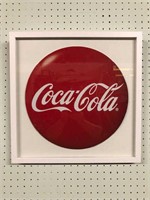 Round Coca Cola Sign on Cardboard