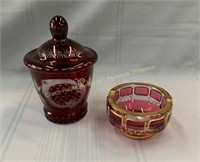 (2) Cranberry glass biscuit barrel and ashtray