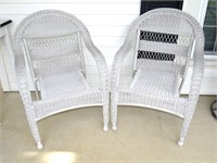 Pair of wicker-style chairs.