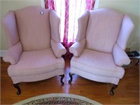 Pair of plush upholstered wingback chairs (Light