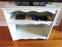 Painted wood TV stand with (2) shelves. Measures