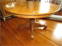 Solid oak dining room table. Approx. 49 in. round