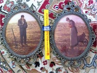 Pair of antique oval prints with metal framing.