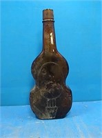 Vintage amber violin shaped liquor bottle