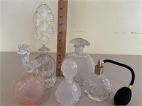 Five perfume bottles