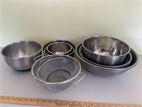 Assortment of stainless steel bowls and cookware