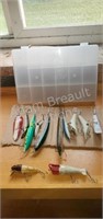 12 assorted fishing lures and plastic storage