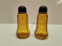 Amber salt and pepper shakers/ plastic tops with