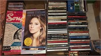 Assortment of CDs and Sheet Music