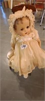 Old Baby Doll with Wooden Chair