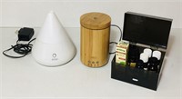2 Oil diffusers and various essential oils.